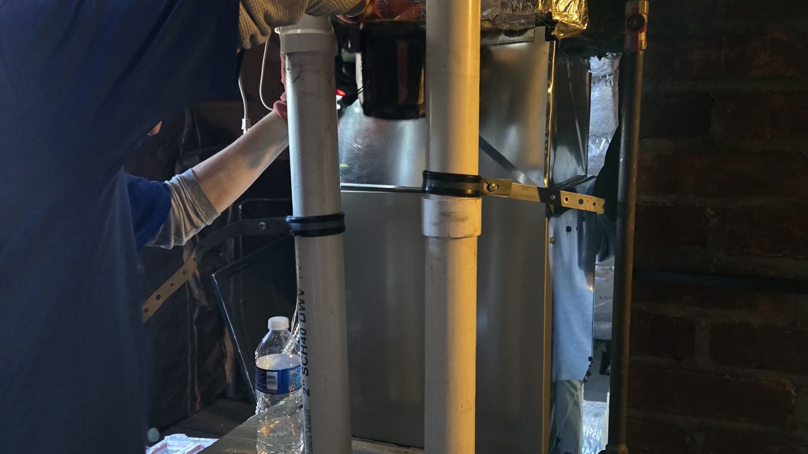 Air conditioning technician servicing residential equipment